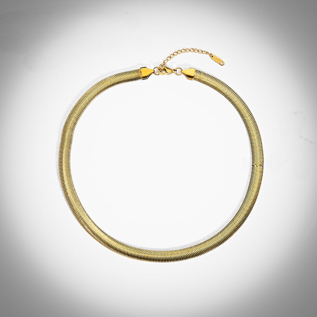 Bold Elegance: Thick Gold Herringbone Necklace. Elevate your style with this stunning accessory. Shop now and make a fashion statement.